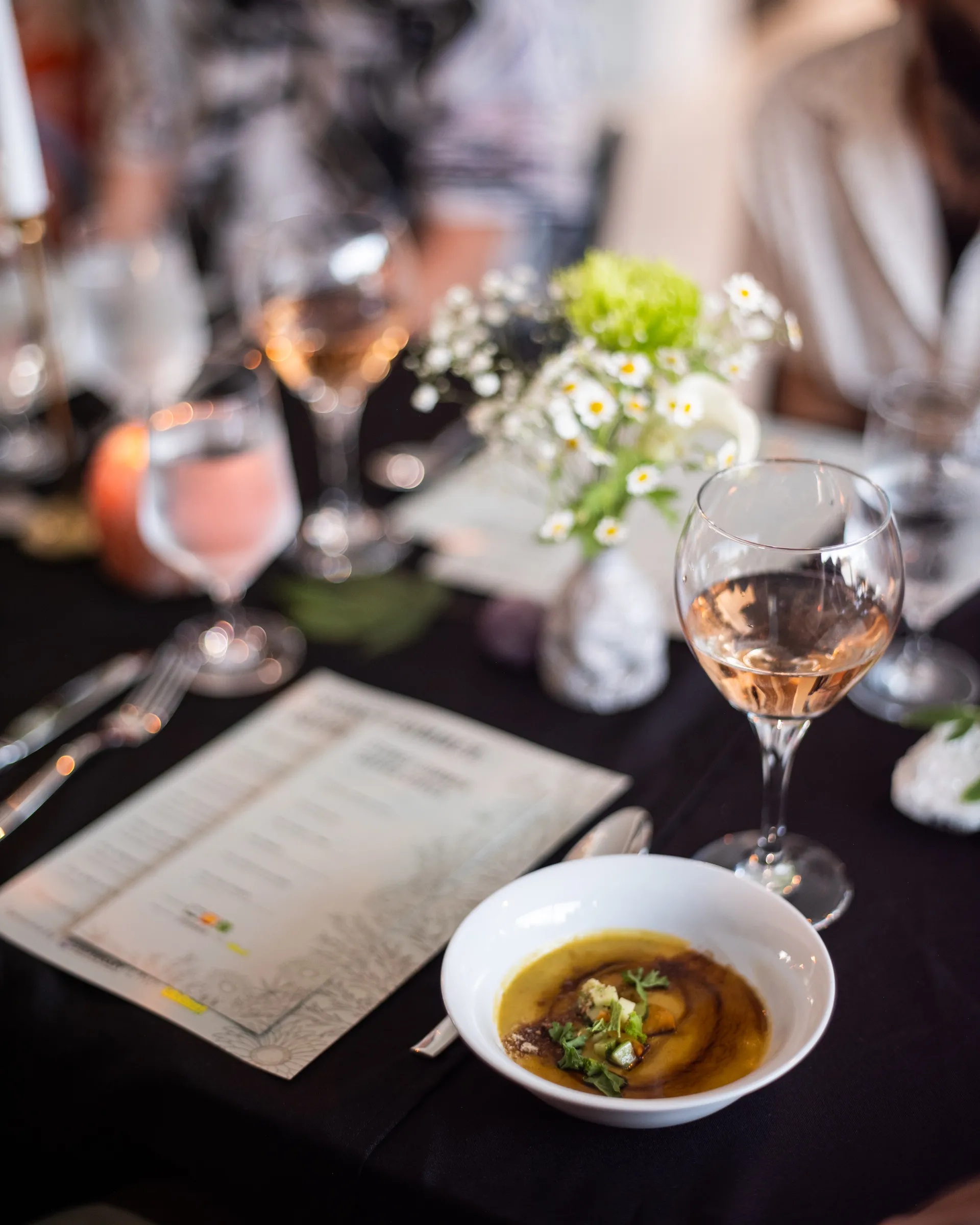 A plated dish garnished with a cannabis leaf at a Doobie infused dinner.